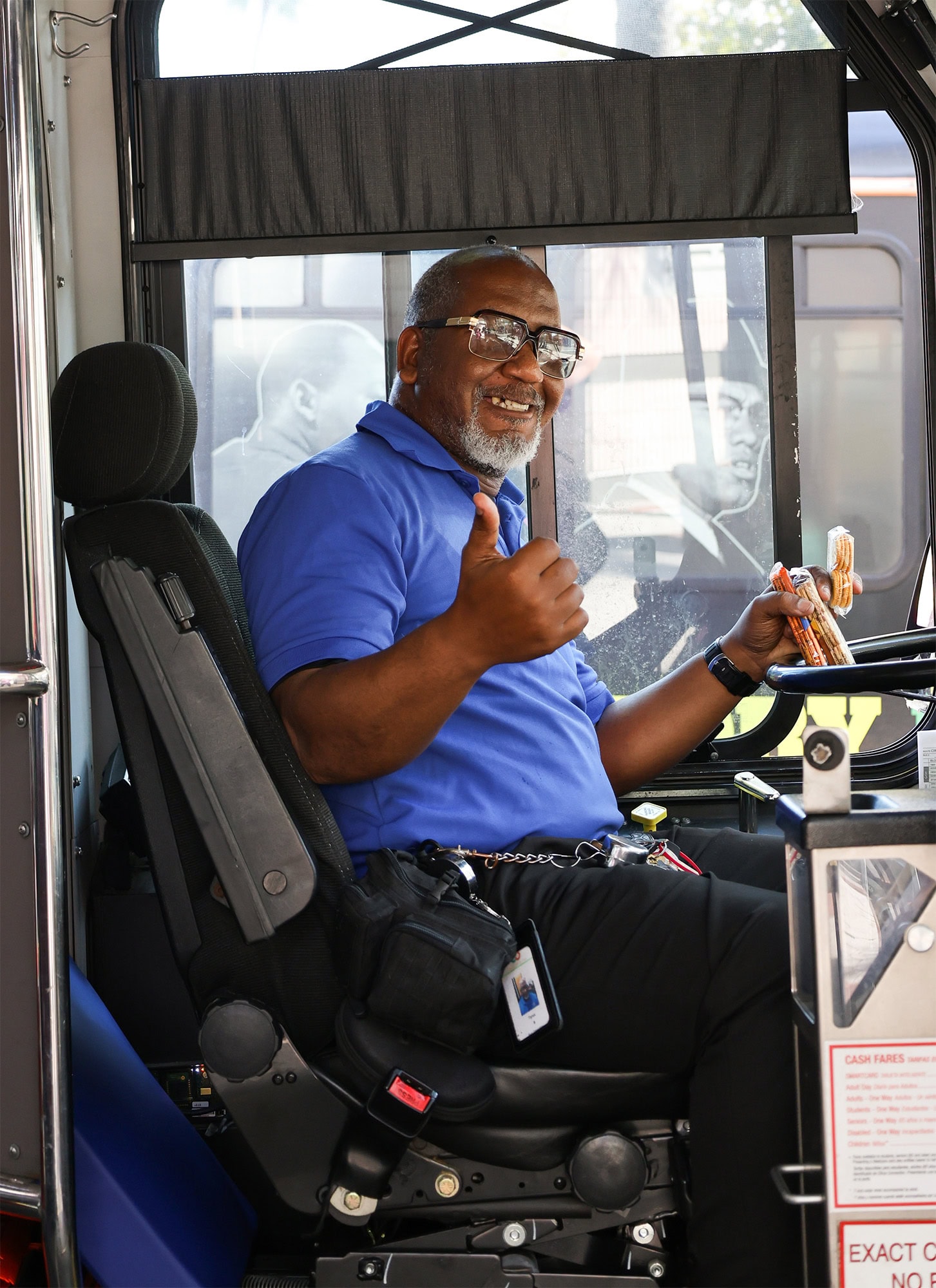 Bus driver welcoming passengers