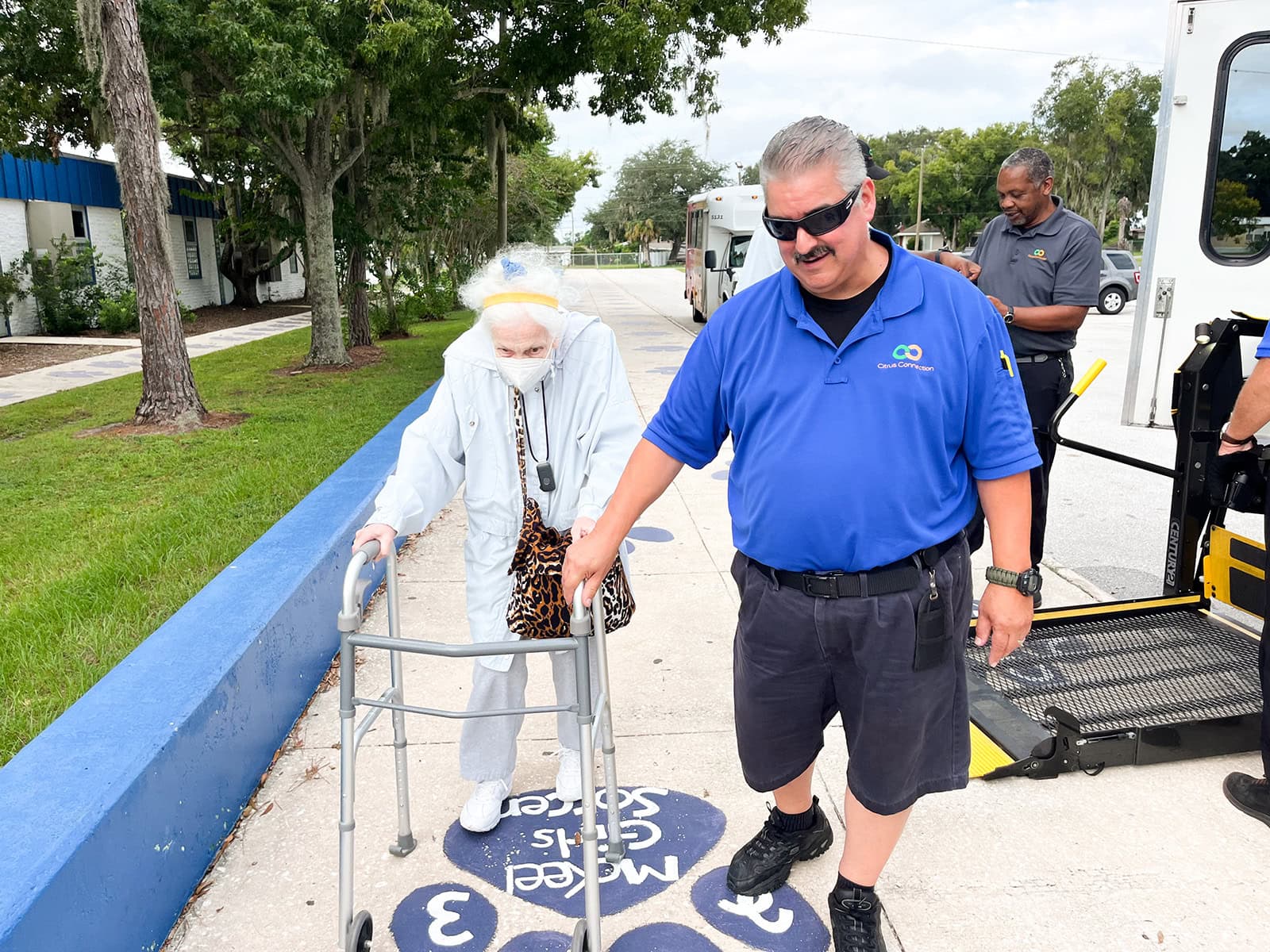 Citrus Connection employee helping a passenger