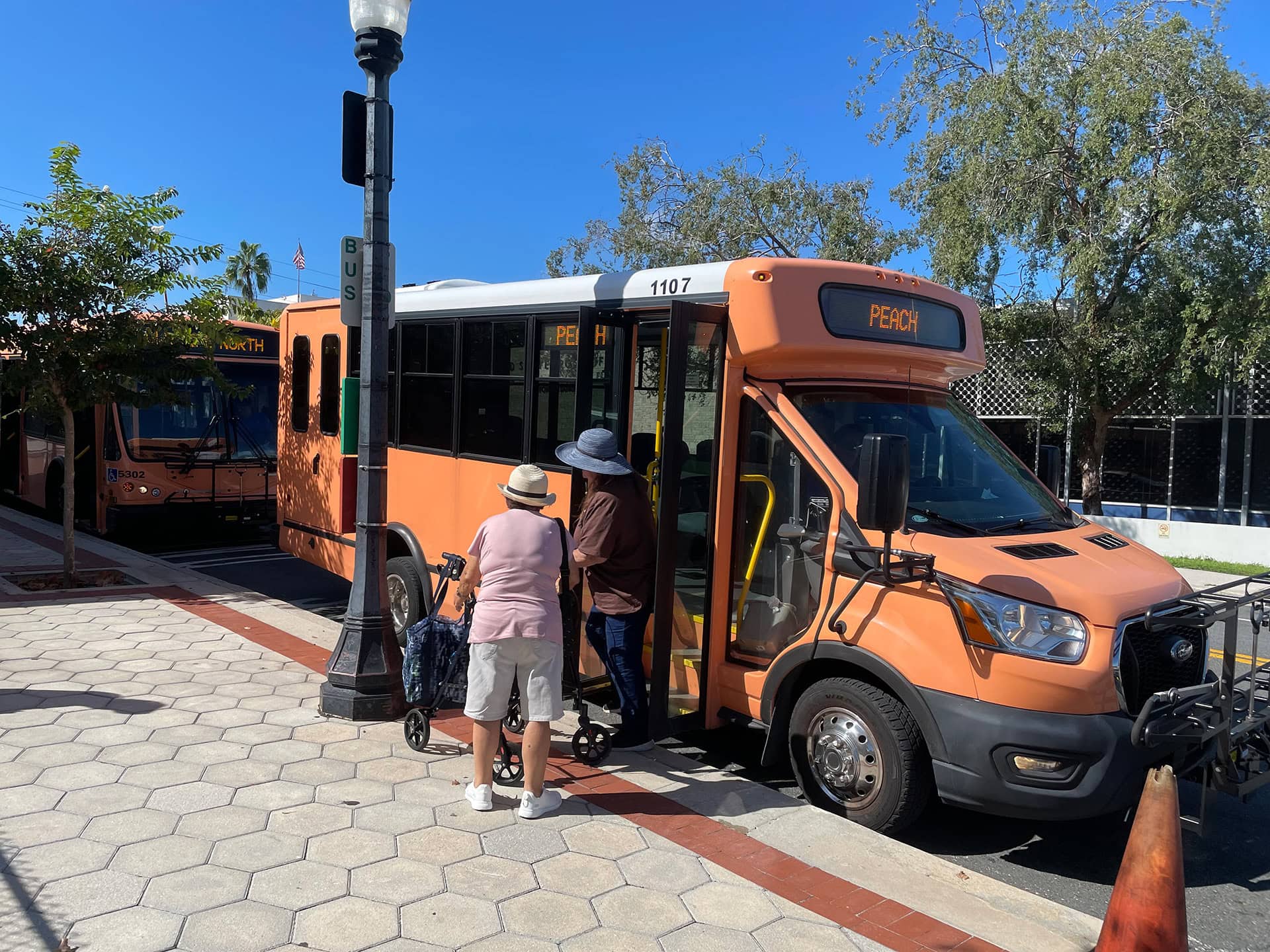 Passengers disembarking from a bus