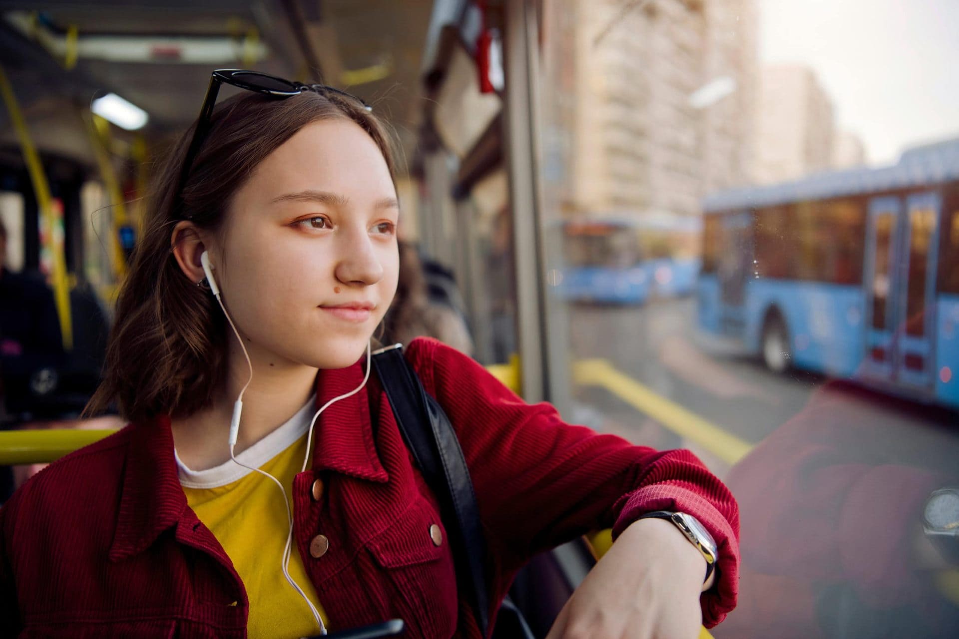Young woman riding bus to work
